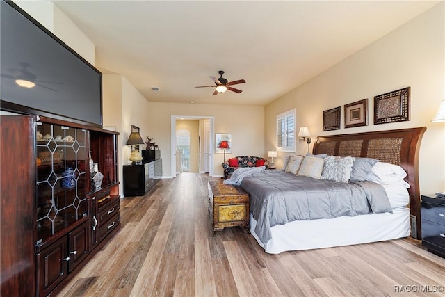 bedroom featuring ceiling fan and light hardwood / wood-style flooring