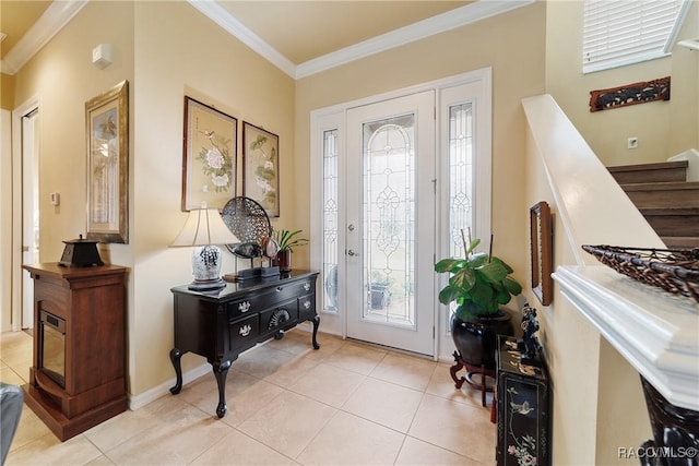 entryway with ornamental molding and light tile patterned floors