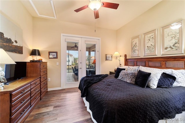 bedroom with access to outside, dark wood-type flooring, french doors, and ceiling fan