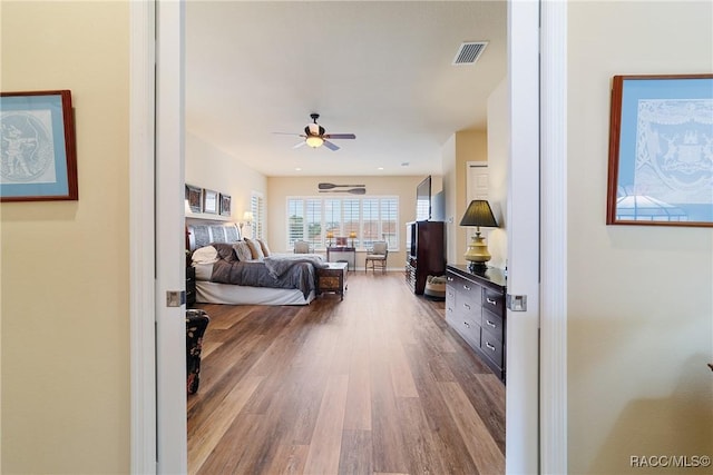 bedroom with hardwood / wood-style floors