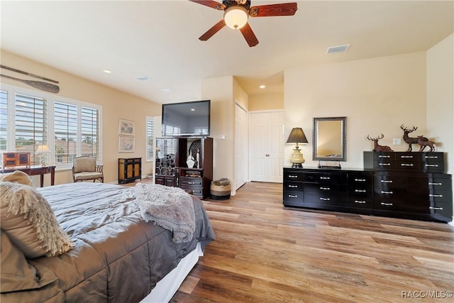 bedroom featuring ceiling fan and light hardwood / wood-style flooring