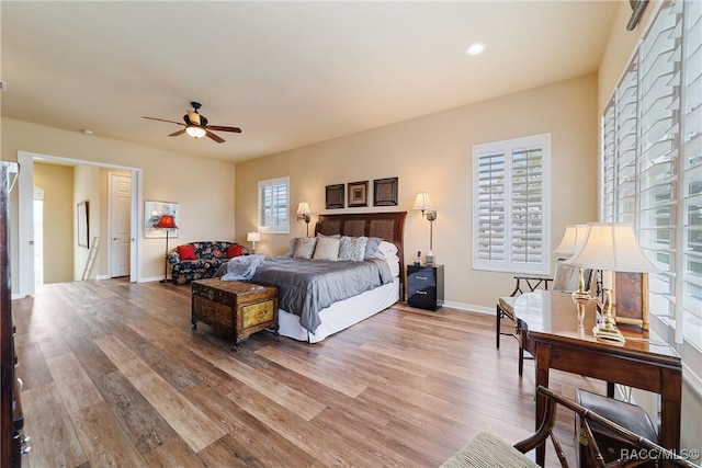 bedroom featuring hardwood / wood-style floors and ceiling fan