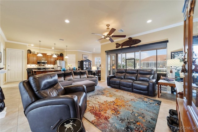 living room with ceiling fan, light tile patterned floors, and ornamental molding