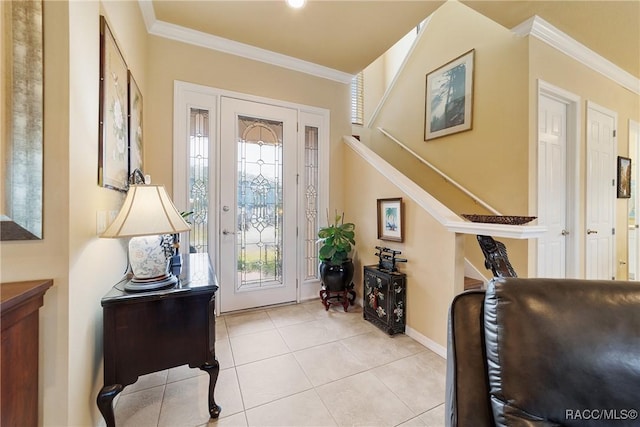 tiled entrance foyer featuring crown molding