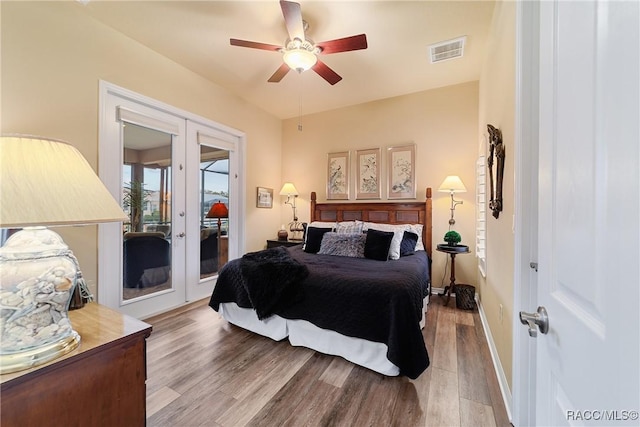 bedroom featuring ceiling fan, french doors, access to outside, and wood-type flooring