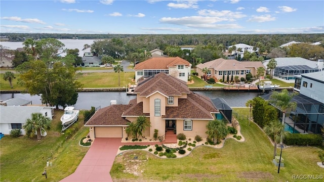 birds eye view of property featuring a water view