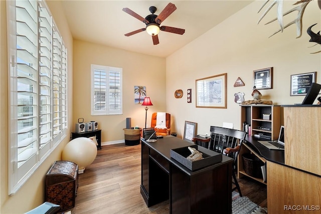 office space featuring hardwood / wood-style floors and ceiling fan