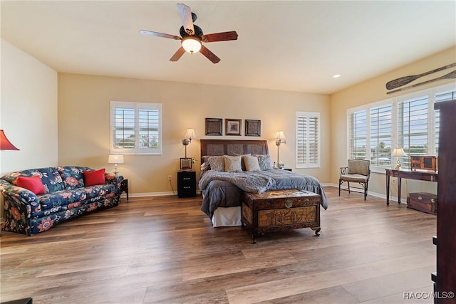 bedroom with hardwood / wood-style flooring and ceiling fan