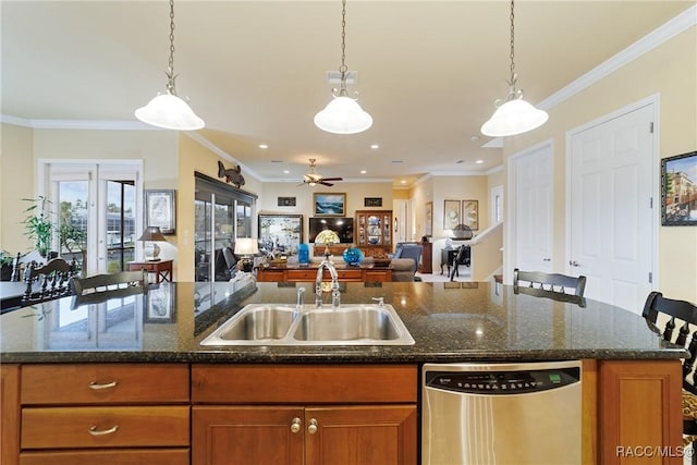 kitchen with sink, ceiling fan, stainless steel dishwasher, and a kitchen island with sink