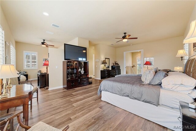 bedroom featuring light wood-type flooring and ceiling fan