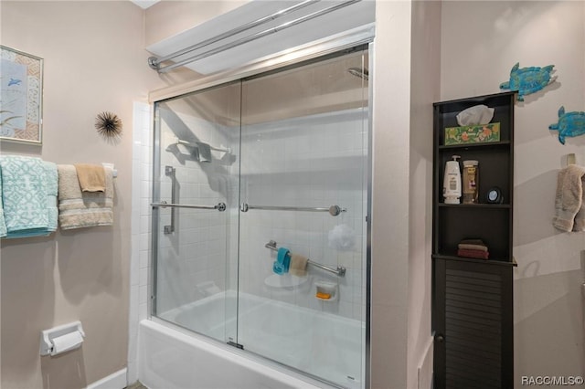 10038 62nd Ter N Unit 2, Saint Petersburg, FL 33708 - full bathroom featuring shower / bath combination with glass door and baseboards