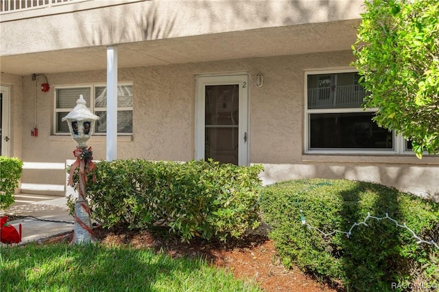 10038 62nd Ter N Unit 2, Saint Petersburg, FL 33708 - doorway to property with stucco siding