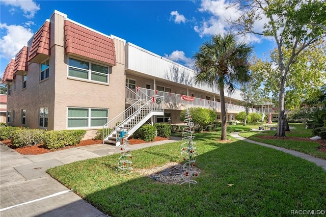 10038 62nd Ter N Unit 2, Saint Petersburg, FL 33708 - view of property featuring stairway