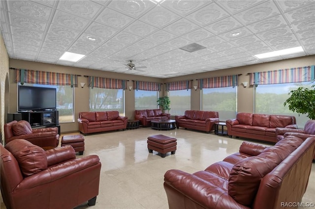 10038 62nd Ter N Unit 2, Saint Petersburg, FL 33708 - living room with an ornate ceiling, a ceiling fan, and tile patterned floors