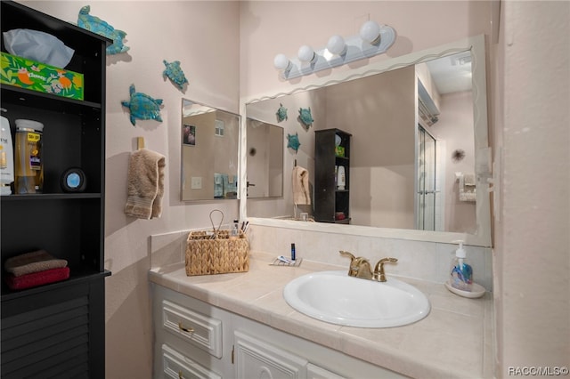 bathroom featuring vanity and walk in shower