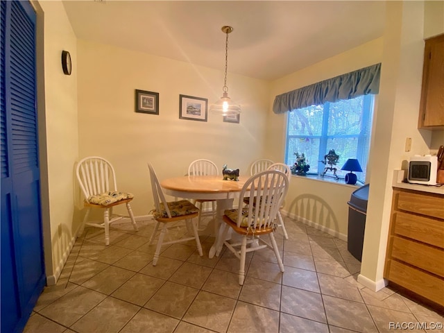 dining area with light tile patterned floors