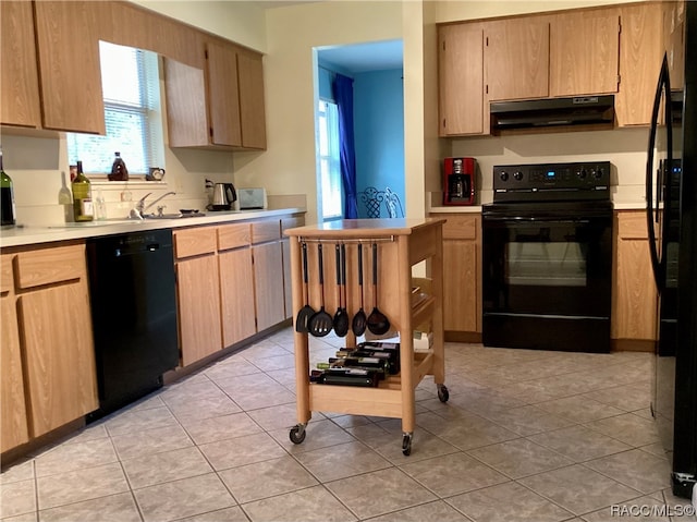 kitchen with sink, light tile patterned floors, black appliances, and range hood