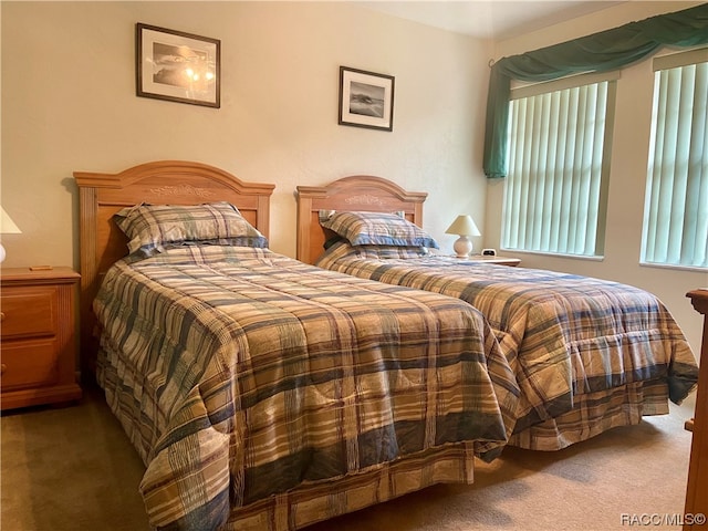 bedroom featuring dark colored carpet