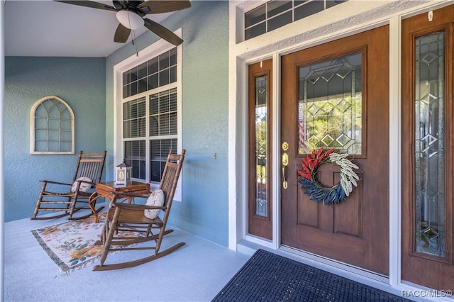 2 Nancy Pkwy, Yankeetown, FL 34498 - doorway to property with a porch, stucco siding, and ceiling fan