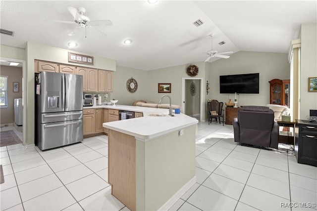 2 Nancy Pkwy, Yankeetown, FL 34498 - kitchen featuring stainless steel appliances, ceiling fan, vaulted ceiling, light brown cabinets, and light countertops