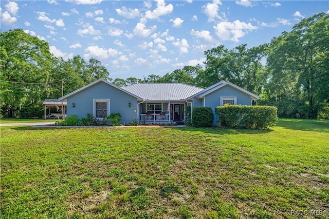 2 Nancy Pkwy, Yankeetown, FL 34498 - ranch-style house featuring a front lawn, a metal roof, and stucco siding