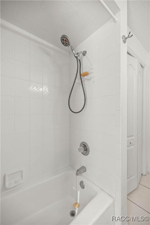 2 Nancy Pkwy, Yankeetown, FL 34498 - bathroom with bathing tub / shower combination and tile patterned flooring