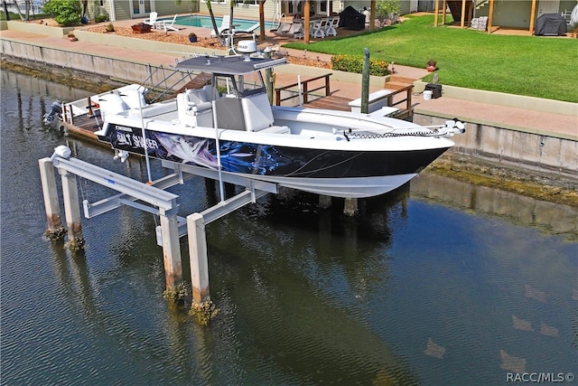 dock area featuring a yard and a water view