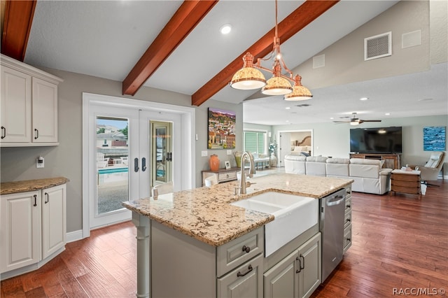 kitchen featuring ceiling fan, dark wood-type flooring, pendant lighting, vaulted ceiling with beams, and white cabinetry