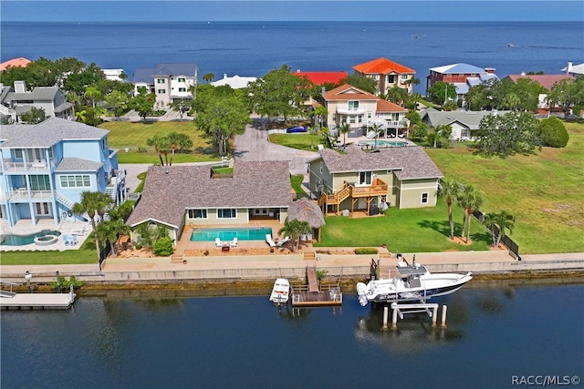 birds eye view of property featuring a water view