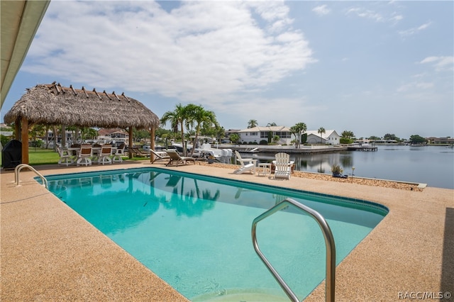 view of pool featuring a gazebo, a patio area, and a water view