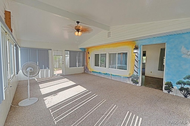 unfurnished sunroom featuring lofted ceiling with beams and ceiling fan