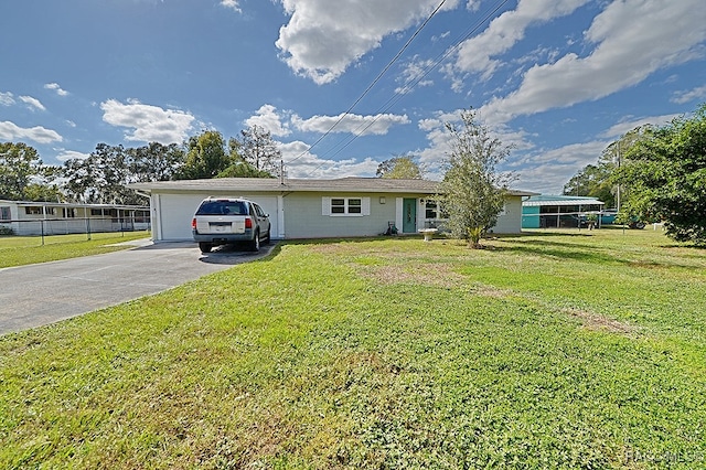 view of front of home featuring a garage and a front yard