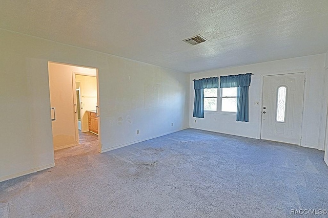 interior space with a textured ceiling