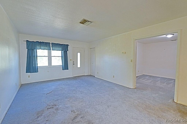 interior space featuring a textured ceiling