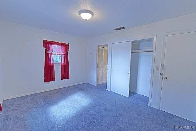 unfurnished bedroom featuring a textured ceiling