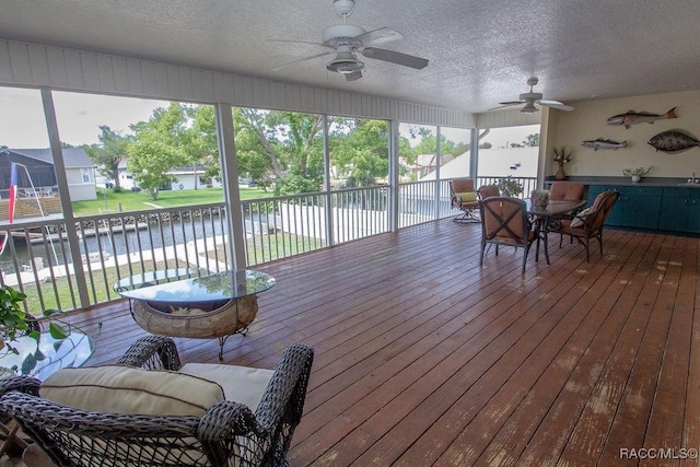 1930 NW 18th St, Crystal River, FL 34428 - sunroom with a ceiling fan, a water view, and outdoor dining space