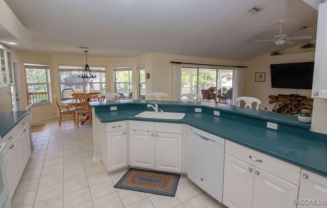 1930 NW 18th St, Crystal River, FL 34428 - kitchen with white dishwasher, a sink, light tile patterned floors, a ceiling fan, and white cabinets