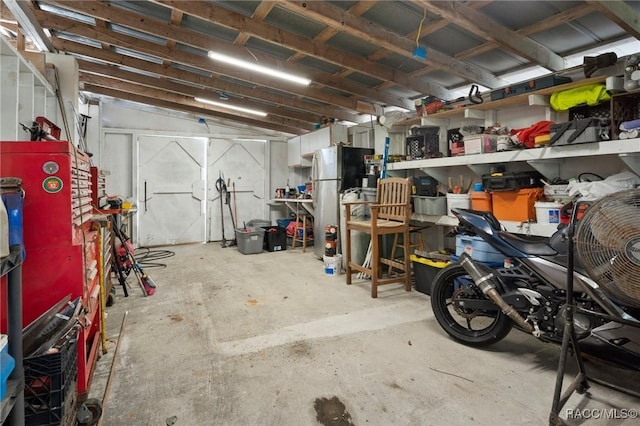 garage featuring stainless steel fridge