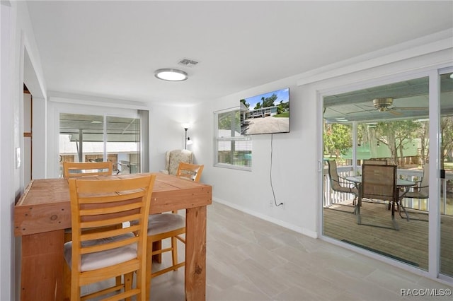 dining space with ceiling fan