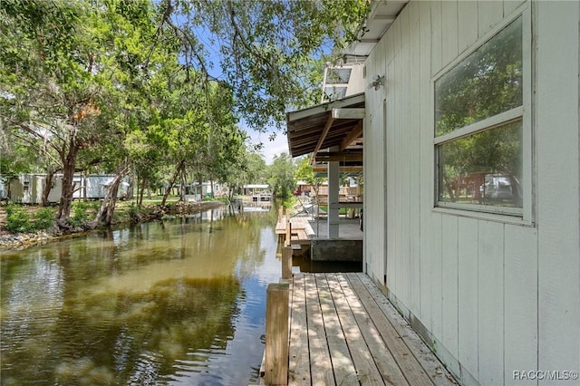 dock area with a water view