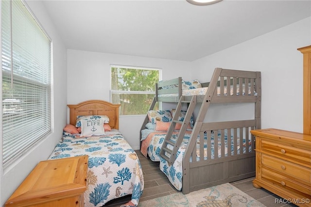 bedroom with dark wood-type flooring