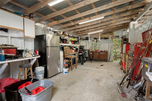 misc room featuring a workshop area and lofted ceiling