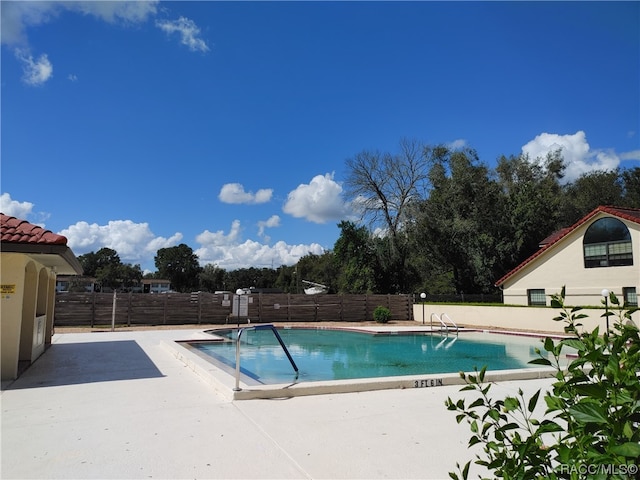 view of pool featuring a patio area