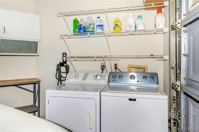 clothes washing area with separate washer and dryer