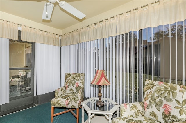 sitting room featuring carpet flooring and ceiling fan