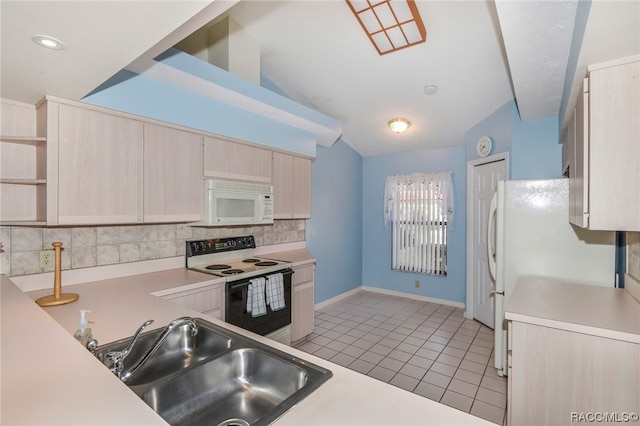 kitchen featuring sink, vaulted ceiling, white appliances, decorative backsplash, and light brown cabinetry