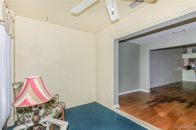 interior space featuring ceiling fan