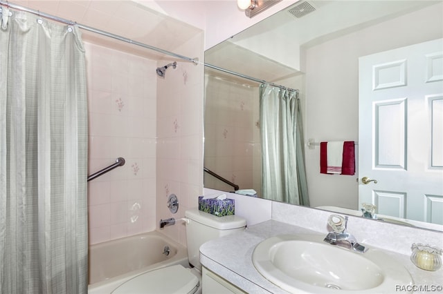 full bathroom with shower / bath combo, vanity, and toilet