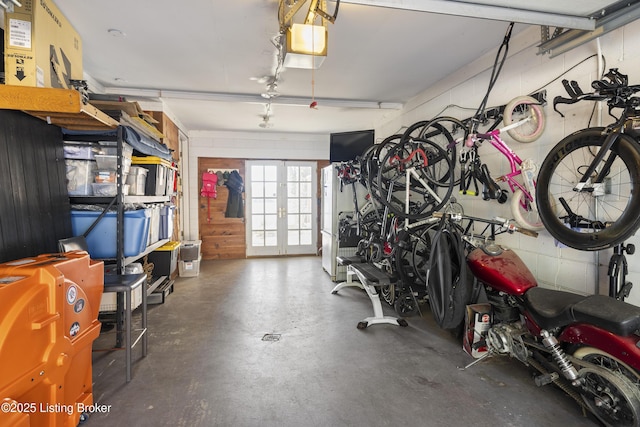 garage featuring a garage door opener and french doors