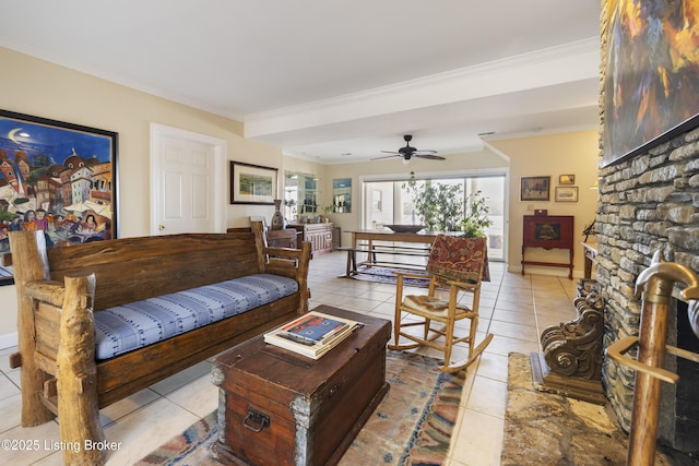 tiled living room with crown molding and ceiling fan